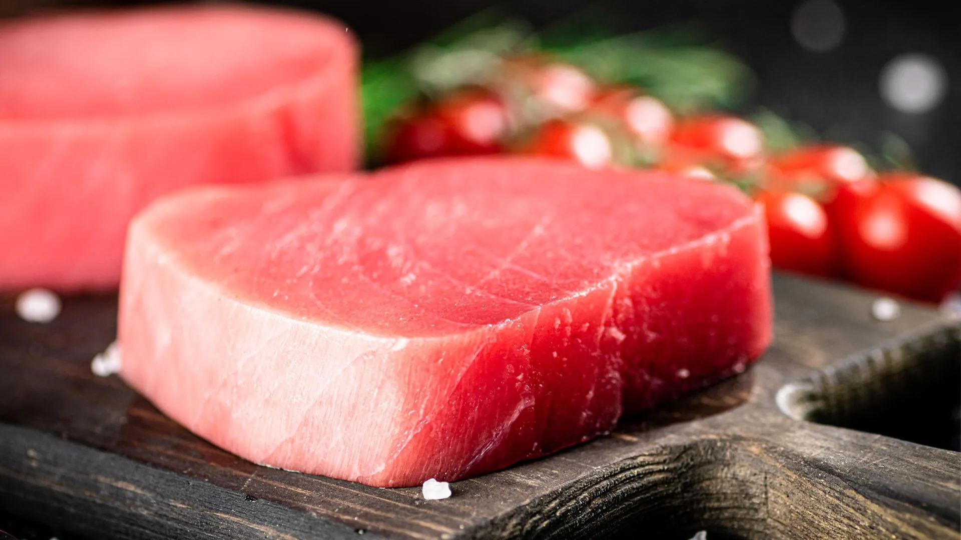 Premium tuna loin on dark slate